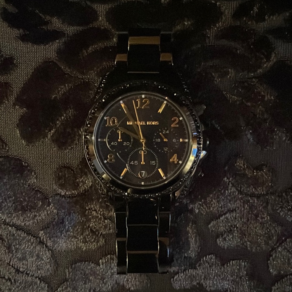 Black and gold Michael Kors watch